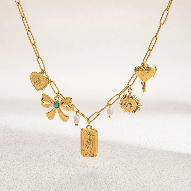 PVD Coated Real Gold Plated Devil's Eye Heart Shape Bow Knot Titanium Steel Lobster Trigger Clasp Closure Pendant Necklace